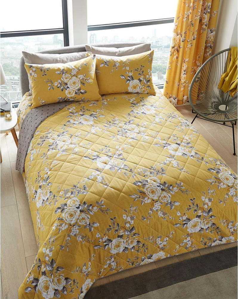 Žlutý přehoz přes postel s motivem květin Catherine Lansfield